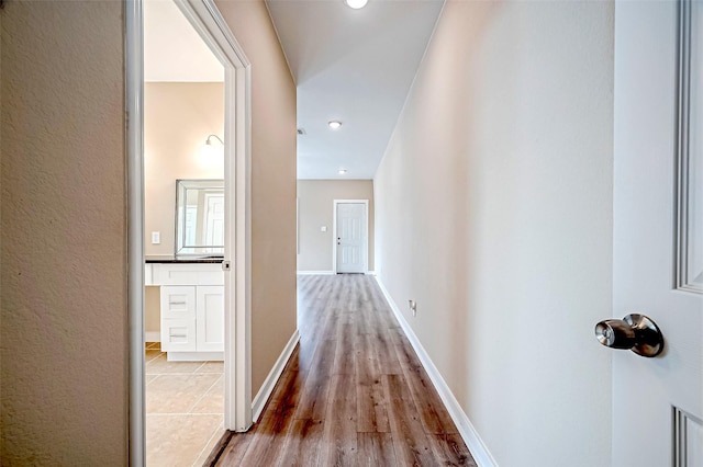 hall with light hardwood / wood-style floors