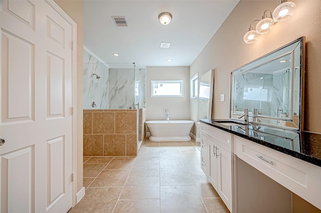 bathroom featuring tile patterned floors, vanity, and plus walk in shower