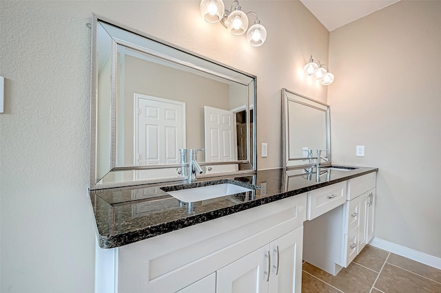 bathroom with tile patterned flooring and vanity