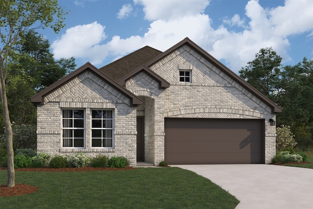 french country inspired facade featuring a garage, concrete driveway, brick siding, and a front yard