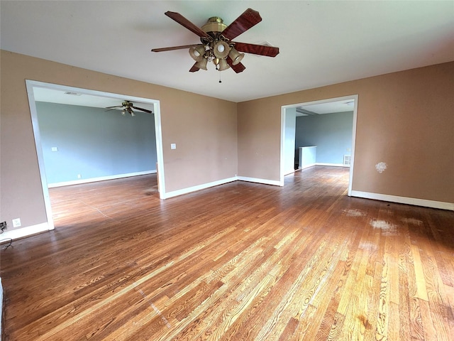 empty room featuring hardwood / wood-style flooring and ceiling fan