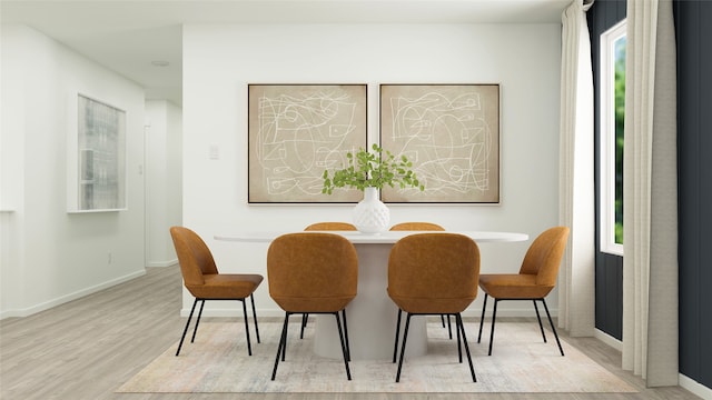 dining space with light hardwood / wood-style floors