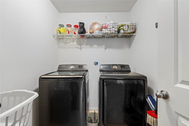 laundry area with separate washer and dryer