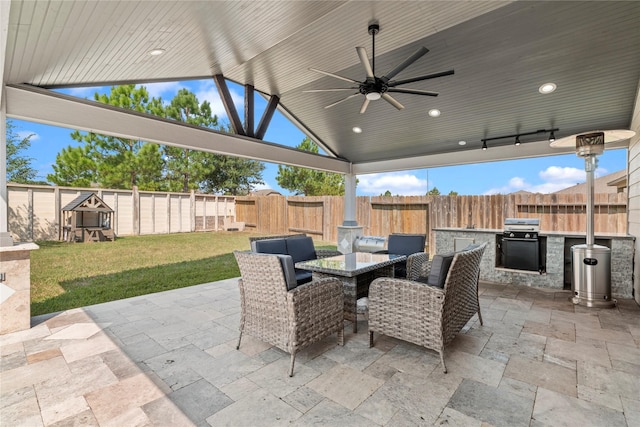 view of patio featuring ceiling fan