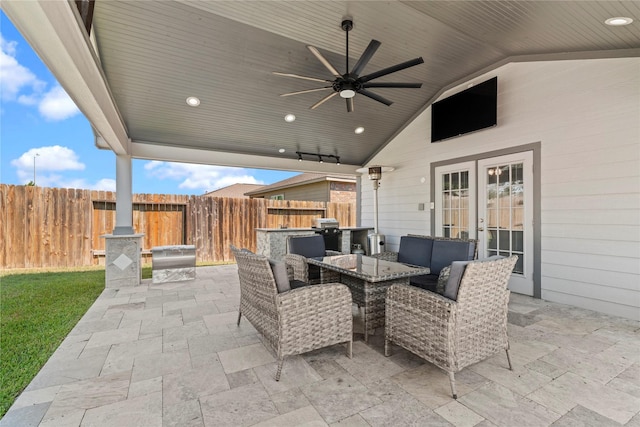 view of patio / terrace featuring an outdoor kitchen, ceiling fan, grilling area, and french doors