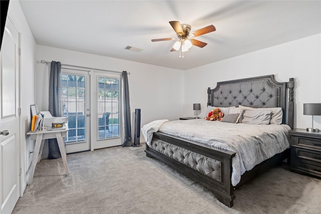 carpeted bedroom featuring french doors, ceiling fan, and access to outside