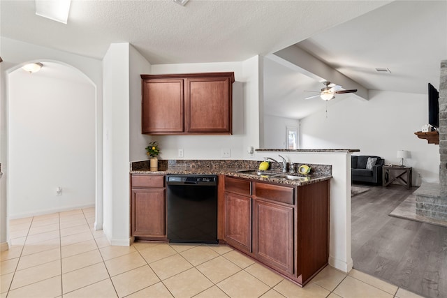 kitchen with lofted ceiling with beams, dishwasher, sink, light tile patterned floors, and ceiling fan