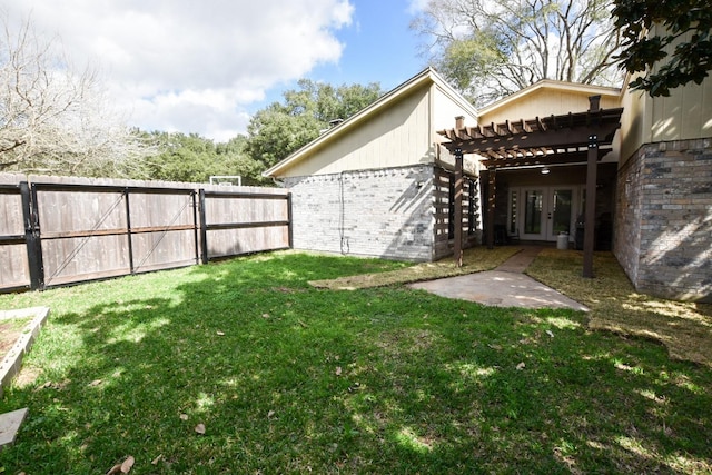 view of yard with a gate, fence, a pergola, and french doors