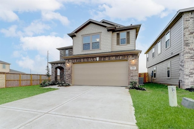 view of front of home featuring a garage, a front lawn, and central air condition unit