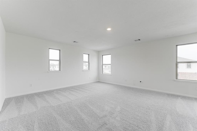 empty room featuring light colored carpet