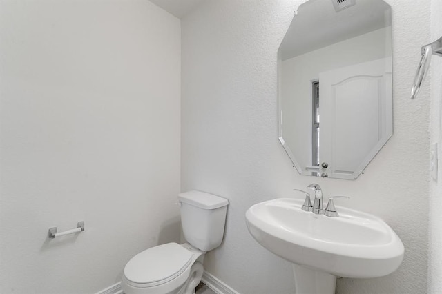 bathroom with sink and toilet