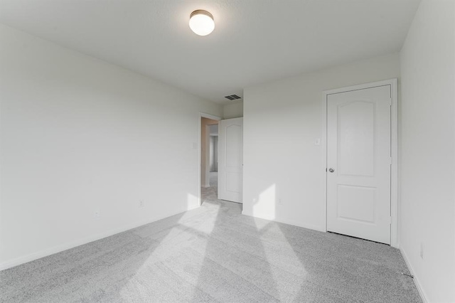 unfurnished bedroom featuring light colored carpet