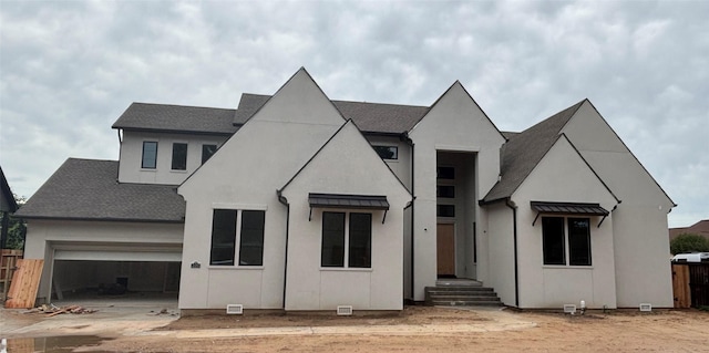 6104 T St, Katy, TX 77493 - view of front facade featuring a garage, a shingled roof, and concrete driveway