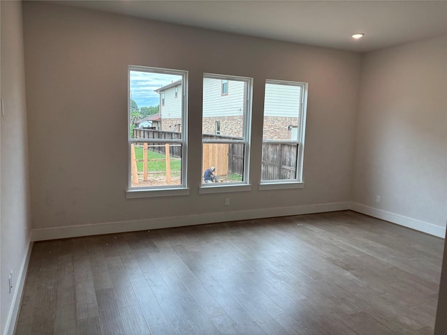 6104 T St, Katy, TX 77493 - spare room with healthy amount of natural light, wood finished floors, baseboards, and recessed lighting