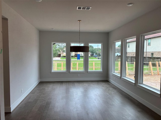 6104 T St, Katy, TX 77493 - unfurnished dining area featuring a chandelier, baseboards, dark wood-type flooring, and recessed lighting
