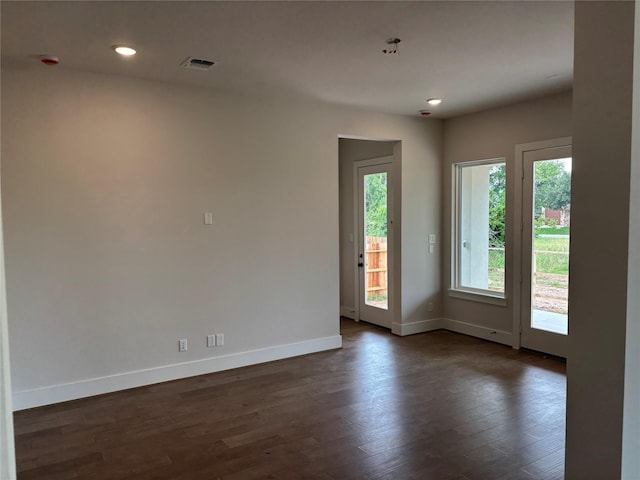 6104 T St, Katy, TX 77493 - empty room with baseboards, dark wood-style flooring, and recessed lighting