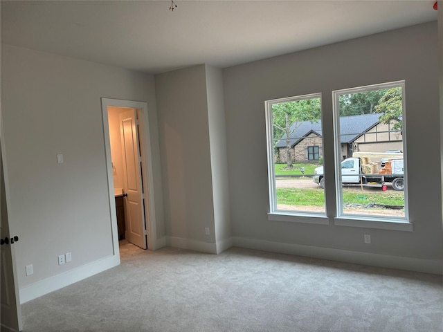 6104 T St, Katy, TX 77493 - spare room featuring light carpet, healthy amount of natural light, and baseboards