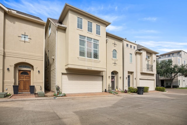 multi unit property featuring a garage