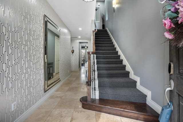 stairway with tile patterned flooring