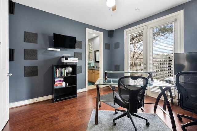 office featuring dark hardwood / wood-style floors and ceiling fan