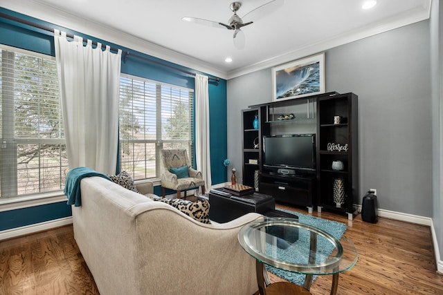 living room featuring crown molding, hardwood / wood-style floors, and ceiling fan