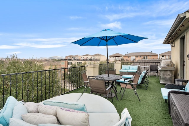 view of patio with a balcony and outdoor lounge area