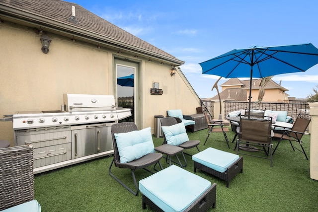 view of patio featuring an outdoor kitchen