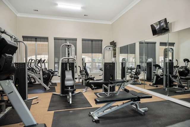 gym featuring crown molding