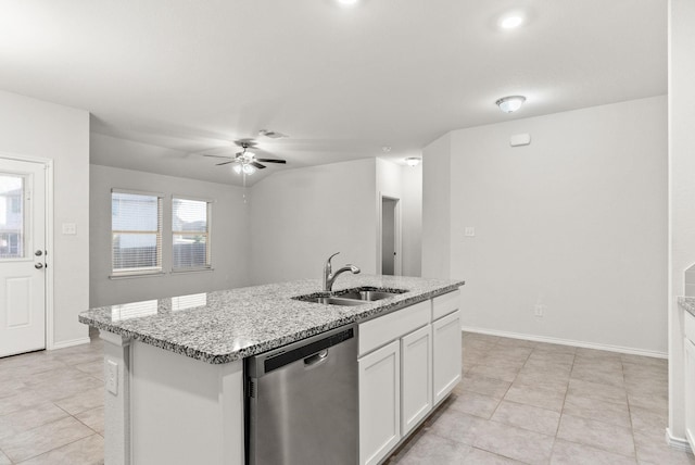 kitchen with sink, white cabinetry, light stone counters, stainless steel dishwasher, and an island with sink