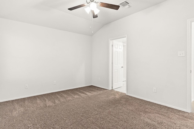 carpeted spare room with vaulted ceiling and ceiling fan