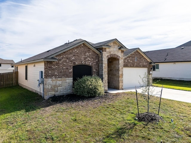 view of front of home with a garage and a front yard