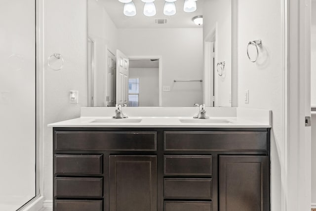 bathroom featuring vanity and walk in shower