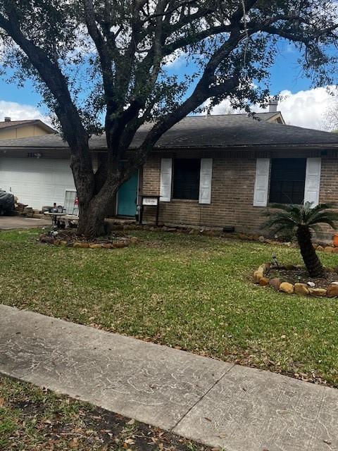 view of home's exterior with a garage and a yard