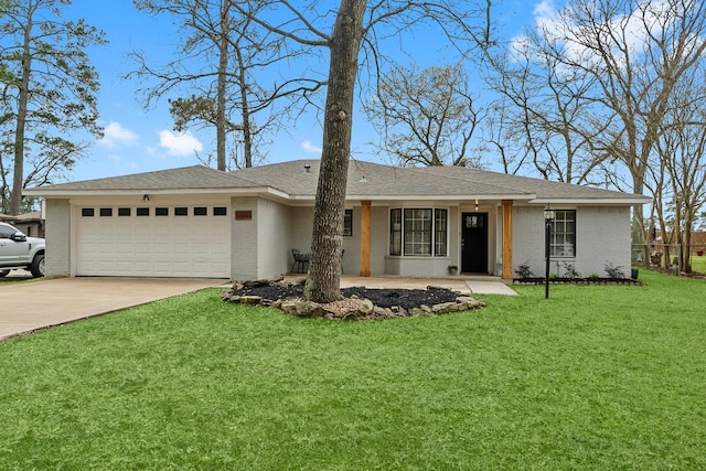 ranch-style home with a garage and a front yard