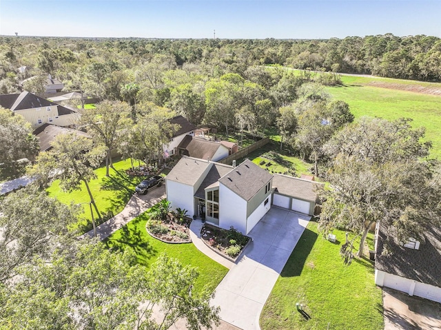 drone / aerial view featuring a view of trees