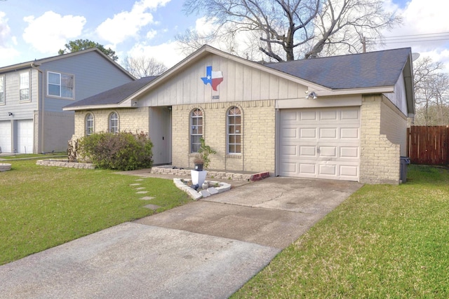 view of front of property with a garage and a front lawn