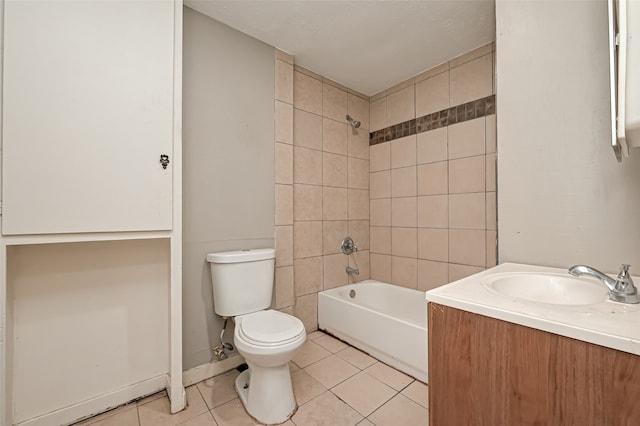 full bathroom with tiled shower / bath combo, vanity, tile patterned floors, and toilet