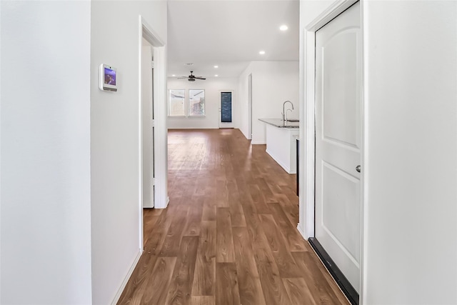 corridor featuring wood-type flooring