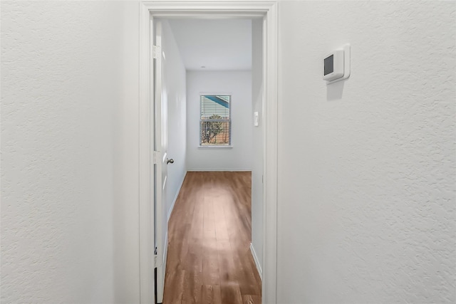 hallway featuring hardwood / wood-style floors