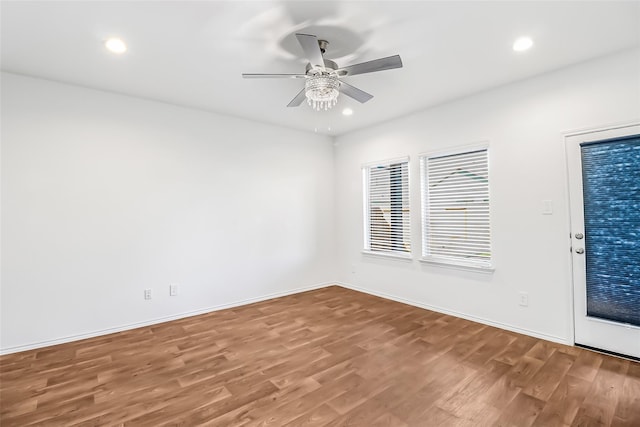 spare room featuring ceiling fan and hardwood / wood-style floors