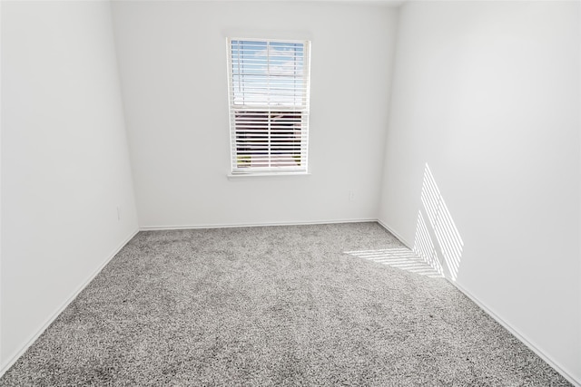 unfurnished room featuring carpet