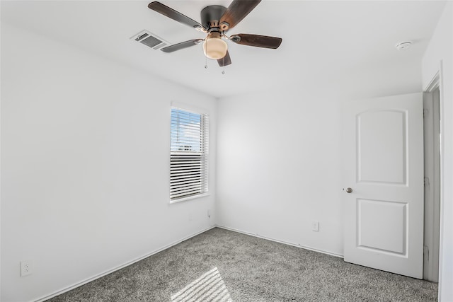 spare room featuring ceiling fan and light colored carpet