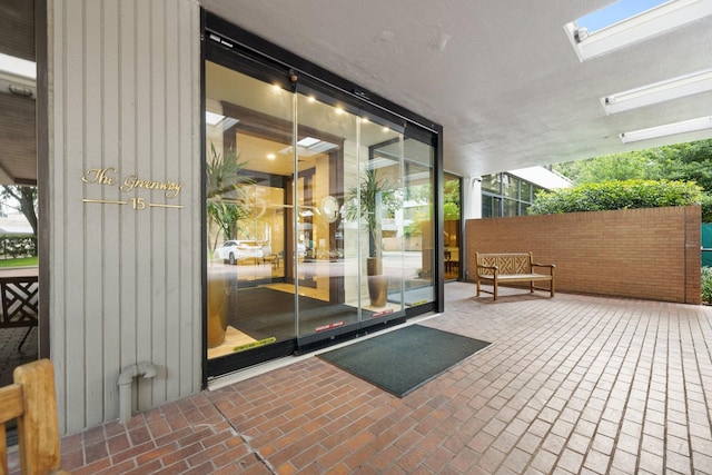 doorway to property featuring a patio area