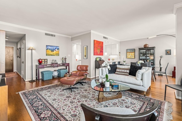 living room featuring crown molding and dark hardwood / wood-style flooring