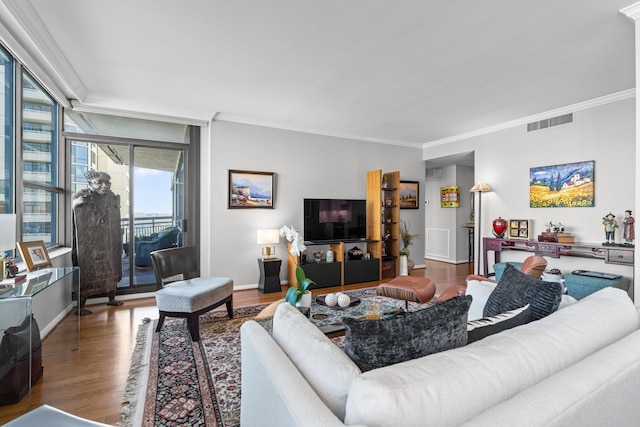 living room featuring ornamental molding and hardwood / wood-style floors