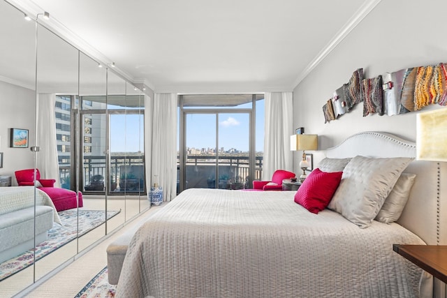 bedroom with carpet floors, access to exterior, a wall of windows, and ornamental molding