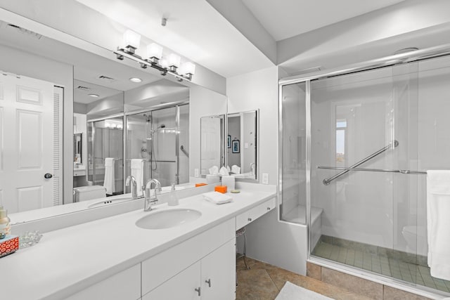 bathroom with vanity and walk in shower