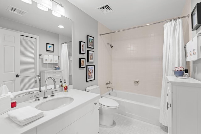 full bathroom featuring tile patterned flooring, vanity, toilet, and shower / bath combo