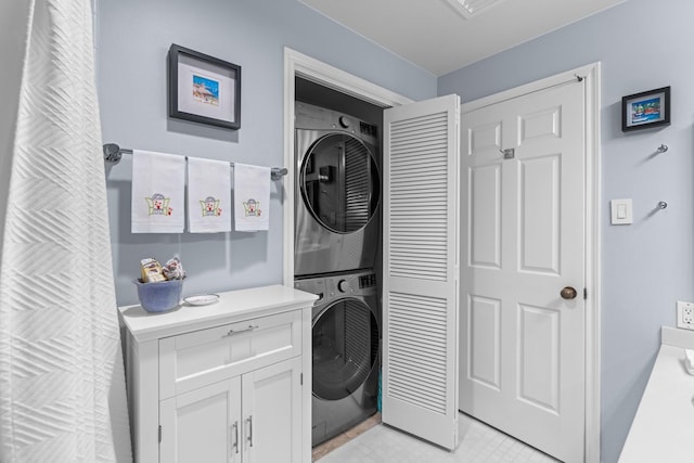 laundry room featuring stacked washer and dryer