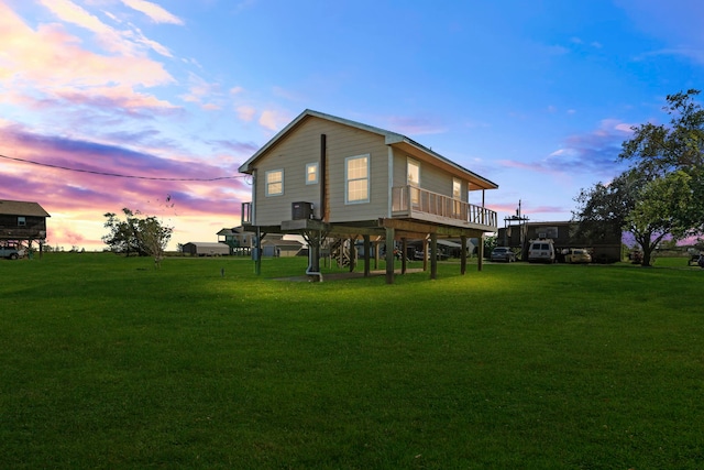 back house at dusk with a yard